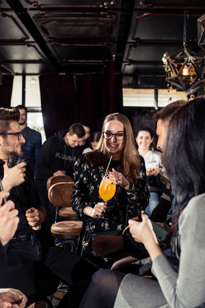 Cocktail bars, cheerful company of friends celebrates February 6th Bartender's Day Minsk, toned, Belarus, 2019のeditorial素材