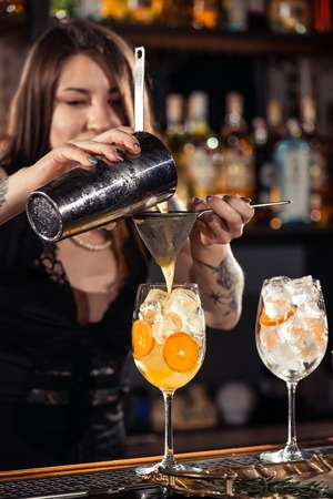 Cocktail bars, bartender making a cocktail February 6th Bartender's Day Minsk, toned, Belarus, 2019のeditorial素材