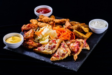 hot sandwiches on a dark background, set of snacks close upの写真素材