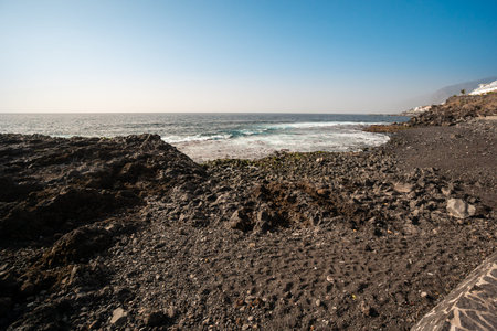 black volcanic sand on the beach of Tenerife