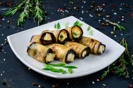 Rustic fried stuffed eggplant with cheese and meat on rustic backgroundの写真素材