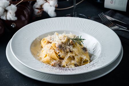 pasta linguine with parmesan cheese, dark background, pasta on a dark backgroundの写真素材