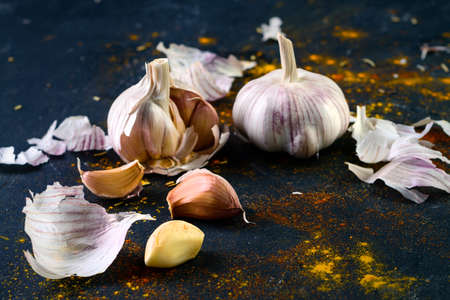 Garlic on vintage texture background, garlic on a darkの写真素材