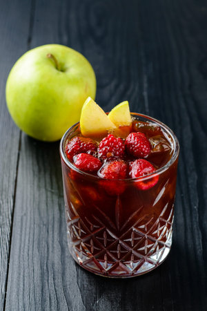 Summer cold cocktail, fruit and berry red wine sangria with apple and raspberry. cold lemonade with raspberries and Apple copy spaceの写真素材