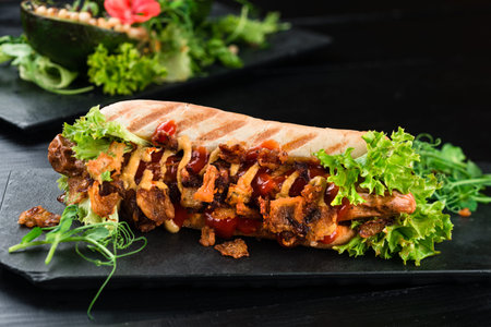 grilled hot dogs with vegetables, expensive hot dog with salad, sausage in dough with herbs and...