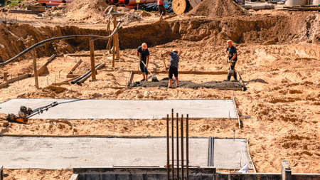 New Property Home Foundation Construction with conrete slab, construction of a concrete Foundationの写真素材