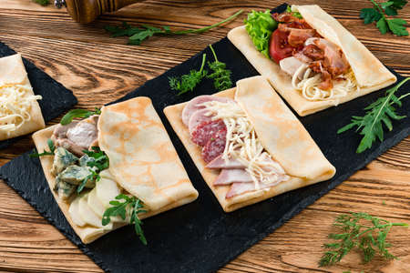 set of crepe with different fillings, pancakes with various fillings with beautiful presentationの写真素材