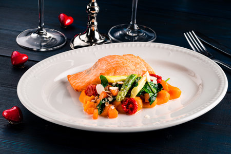 Steam salmon and vegetables, Paleo, keto, fodmap diet on old rustic wooden tableの写真素材