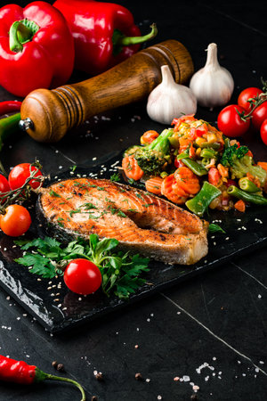 Steam salmon and vegetables, Paleo, keto, fodmap diet on old rustic wooden tableの写真素材