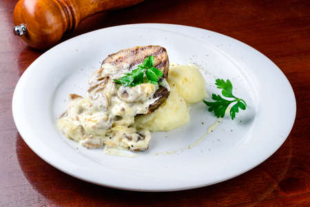 Comfort home cooked food - grilled pork, mashed potatoes with creamy mushroom sauceの写真素材