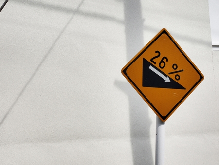 Road signs 26% steep slopeの写真素材