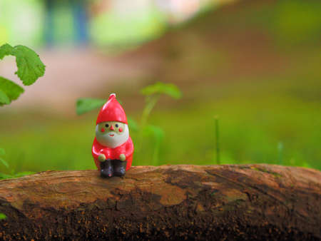 sittingand holding knee santa claus figureの写真素材