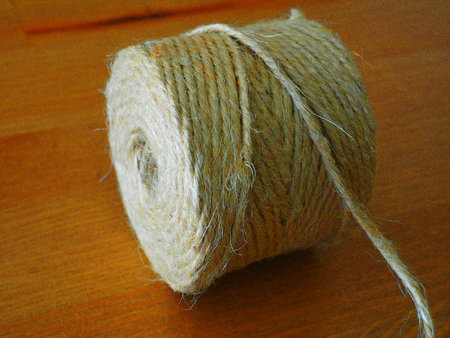 Skein of jute twine on wood table