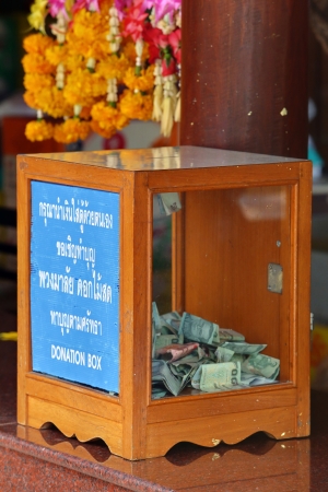 Donation Box with Thai Baht Banknoteの写真素材