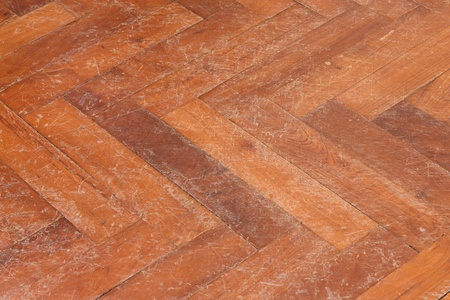 Old and scratched parquet floor surfaceの写真素材