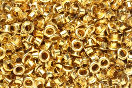 Abstract golden brass eyelets backgroundの写真素材