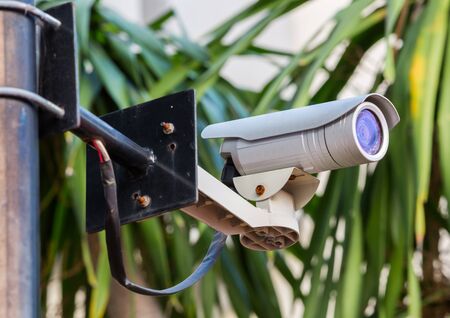 White CCTV camera watching for security 24 hoursの写真素材