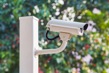 White CCTV camera watching for security 24 hoursの写真素材