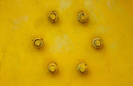 Old nut and bolt on iron plateの写真素材