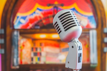 Classic microphone on colorful blur backgroundの写真素材