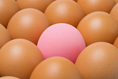 Close up Century egg among chicken eggsの写真素材