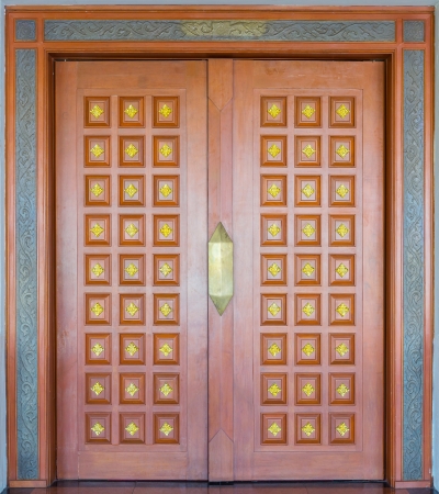 Elegance brown and golden color wood carving doorの写真素材