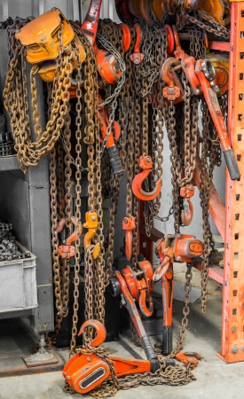 Heavy duty chain hooks and reels in warehouseの写真素材