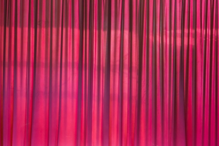 Closed red Theater curtain before the show beginの写真素材