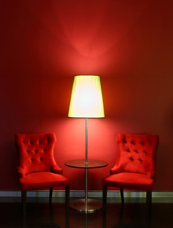 Red elegance and luxury chairs with table and lampの写真素材