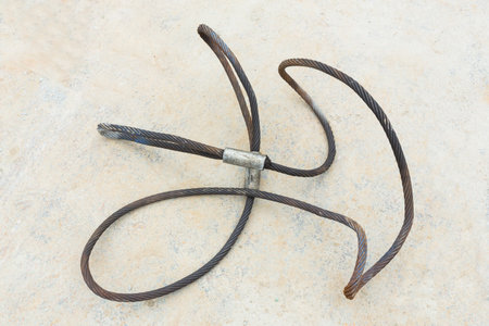 Old steel wire rope sling in construction site