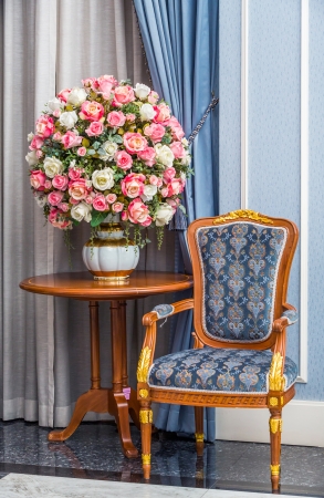 Elegance armchair with beautiful flower bouquet in luxury houseの写真素材