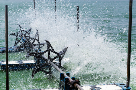 Stop action of water and aerator turbine in lake with high speed shutter 1/8000 secondの写真素材