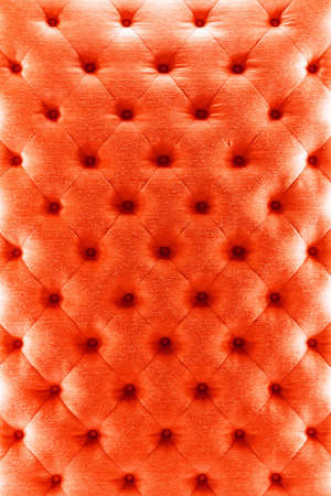 Close up vintage style red color sofa cloth texture with buttonsの写真素材