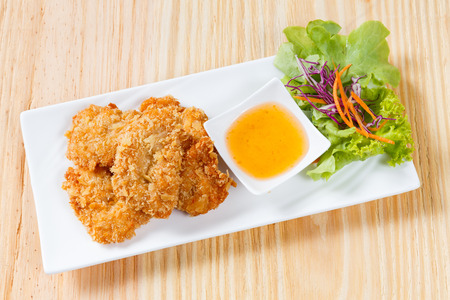 Close up deep fried shrimp cake served with sweet apricot sauceの写真素材