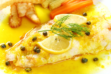 Close up dolly fish steak with lemon sauce