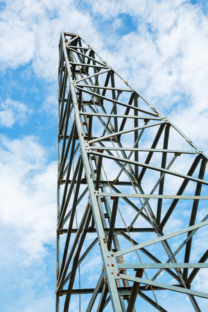 Close up old and rusty pile driver in blue sky with white cloudの写真素材
