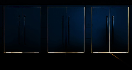 Light coming through the space between the closed door and jambの写真素材