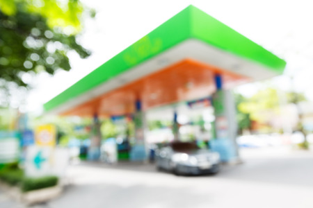 Blurry gas station with car fill up fuel in daytimeの写真素材