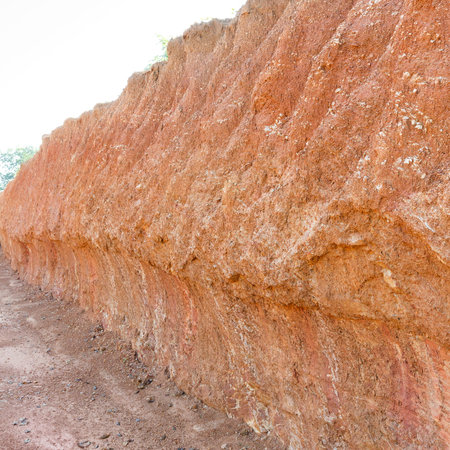 Close up red color lateritic soil cross section