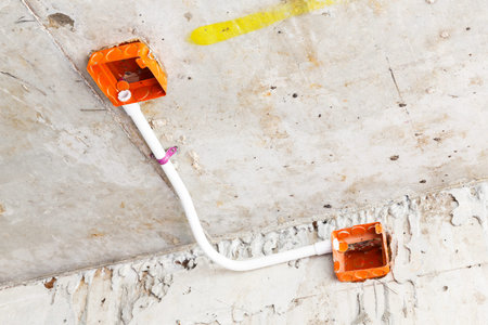 Close up electrical distribution system installation on ceiling in new building