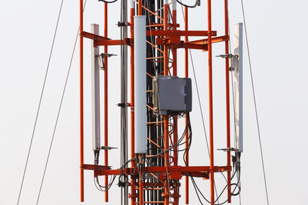 Close up antenna repeater cell tower in city