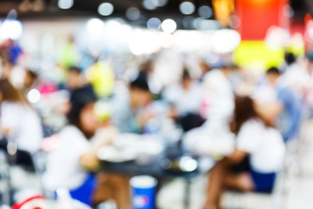 Close up abstract blurred people in food centerの写真素材