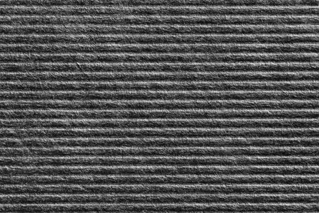 Close up black color corrugated paper texture