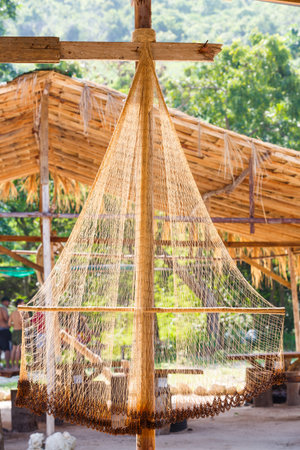 Close up fishing net against sun light with blur background