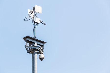 CCTV IP camera with wireless network on blue sky