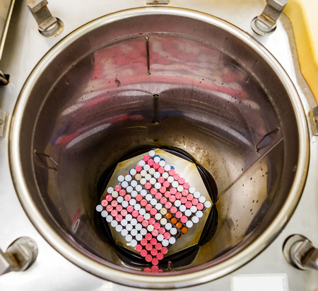 Close up contaminated and dirty test tubes with racks in autoclave chamber, microbiology laboratoryの写真素材
