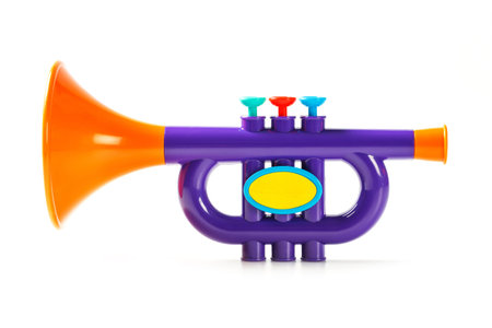 Close up plastic toy trumpet for children isolated on white
