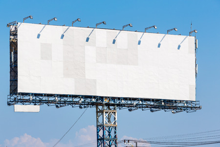 Blank billboard on blue sky ready for new advertisementの写真素材