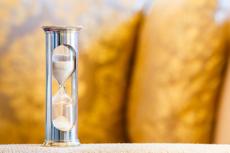 Close up hourglass or sand glass in living room, time value  concept