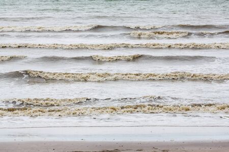Stop action churning sea water with high shutter speedの写真素材